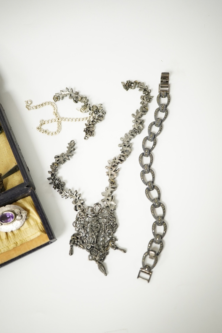 A group of mainly silver and white metal costume jewellery, including a moonstone set brooch, 53mm, a filigree gilt metal and enamel fob and marcasite set bracelet etc.